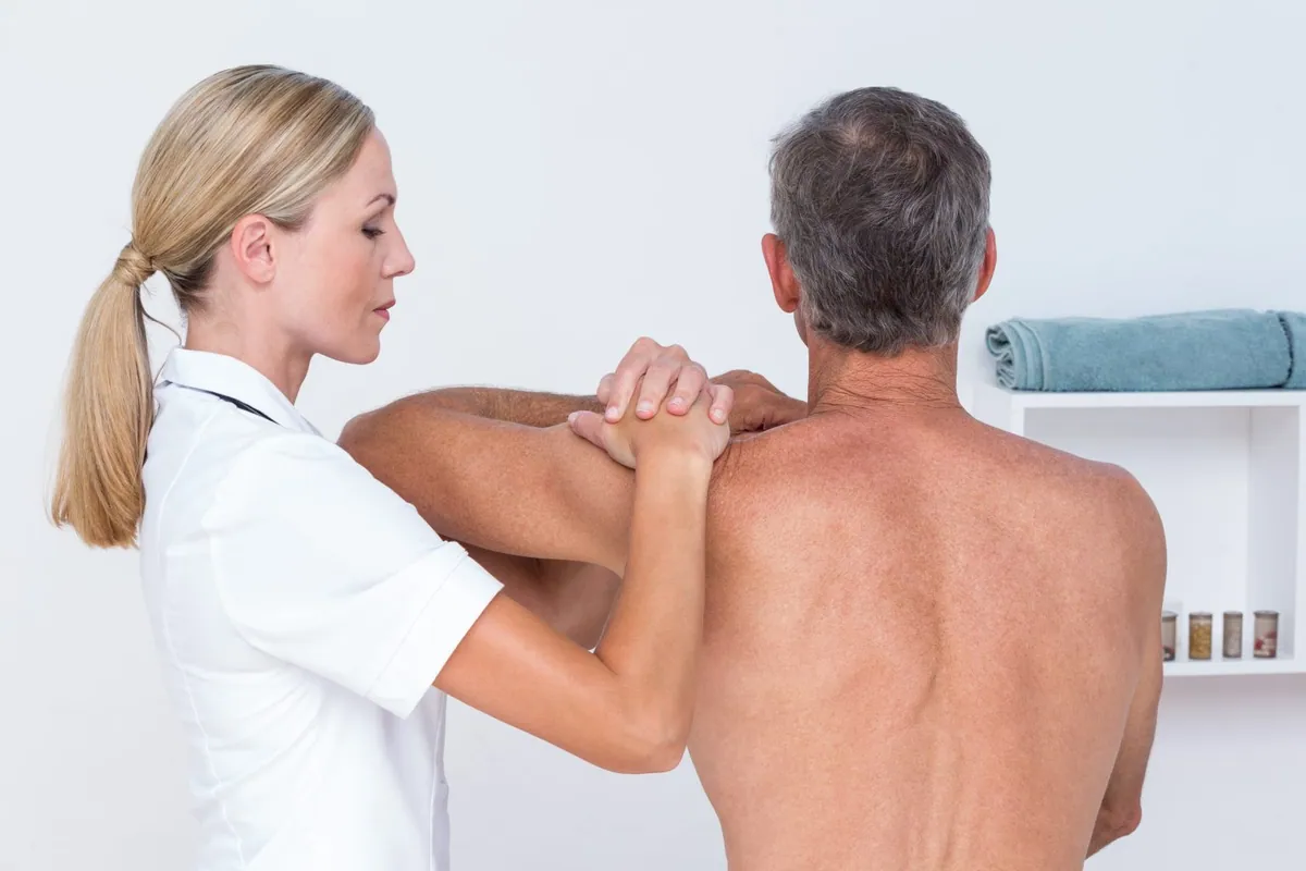 Doctor examining a patient's shoulder